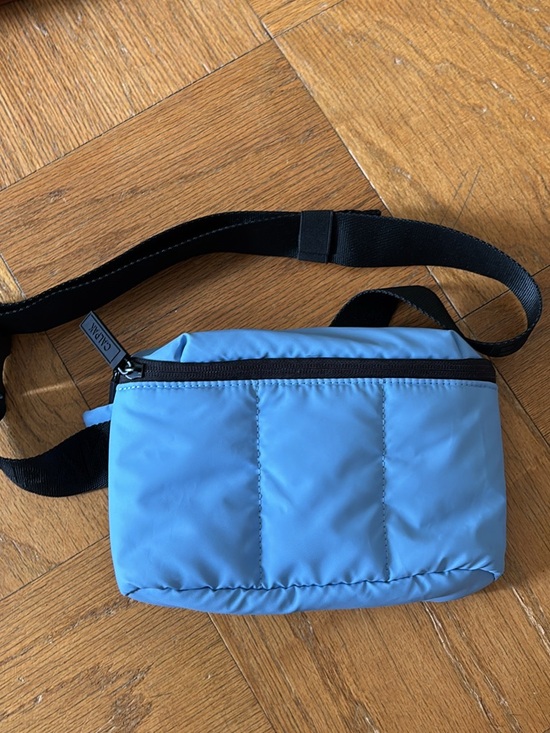 Calpak Handbags - Calpak light blue padded mini crossbody bag with black strap